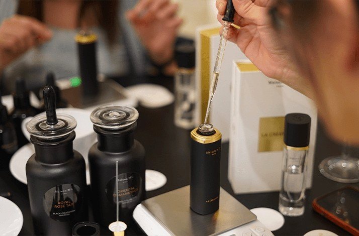 A person blending unique accords to create a fragrance.